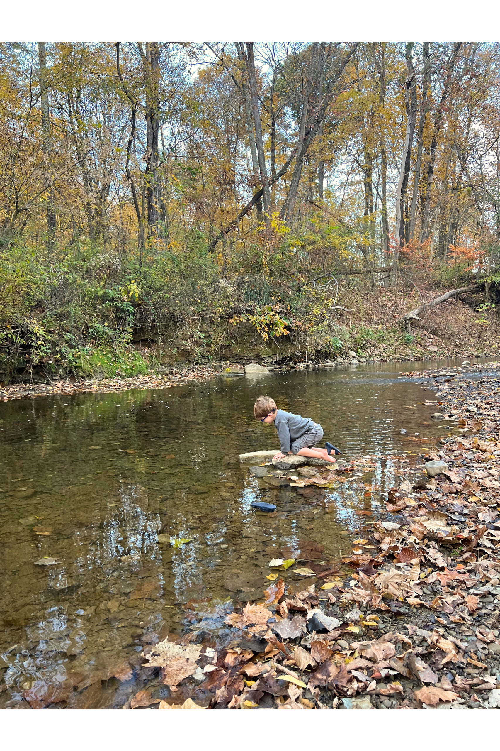 A child playing in the waters of Salt Creek.