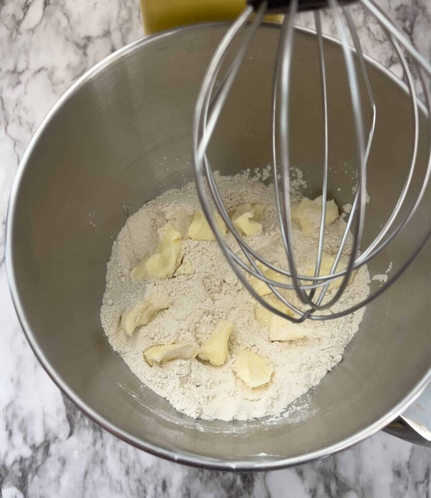 Crumbled butter and dry ingredients in a stand mixer. 