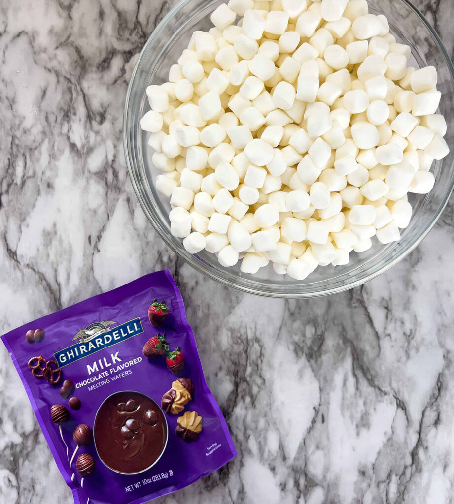 Melting chocolates and marshmallows on a countertop.
