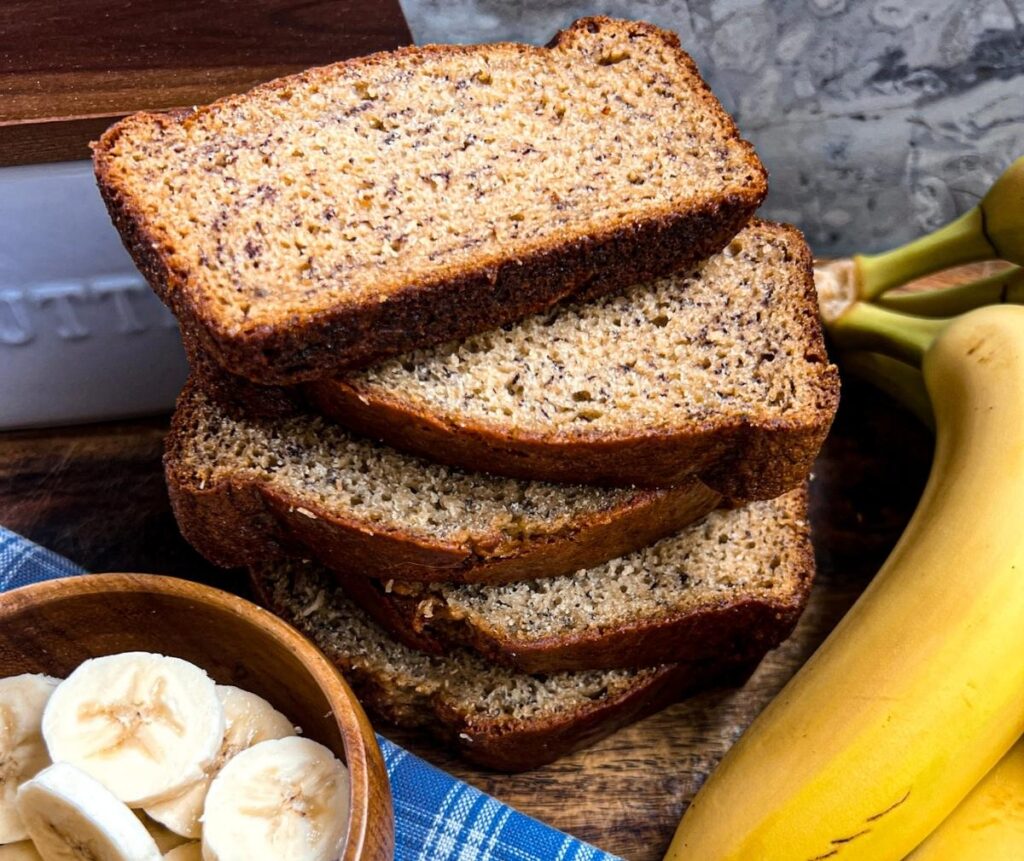 Slices of banana bread are stacked on top of each other. 