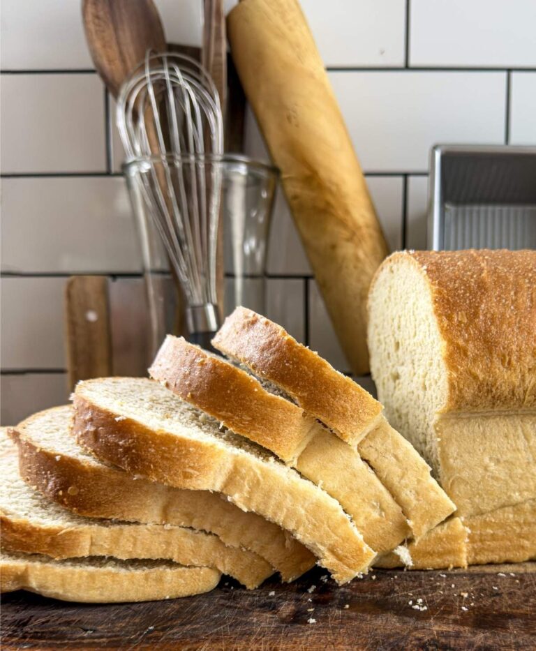 Several slices of beginner friendly sandwich bread coming off the loaf.