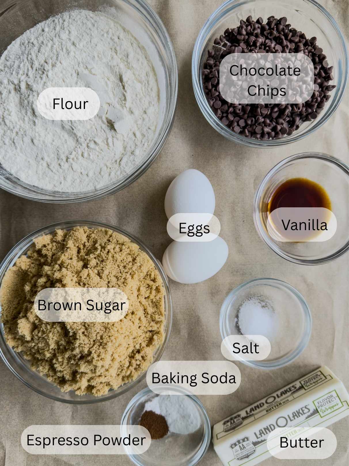 A picture of the ingredients for Magnolia style chocolate chip cookies on a brown paper background.